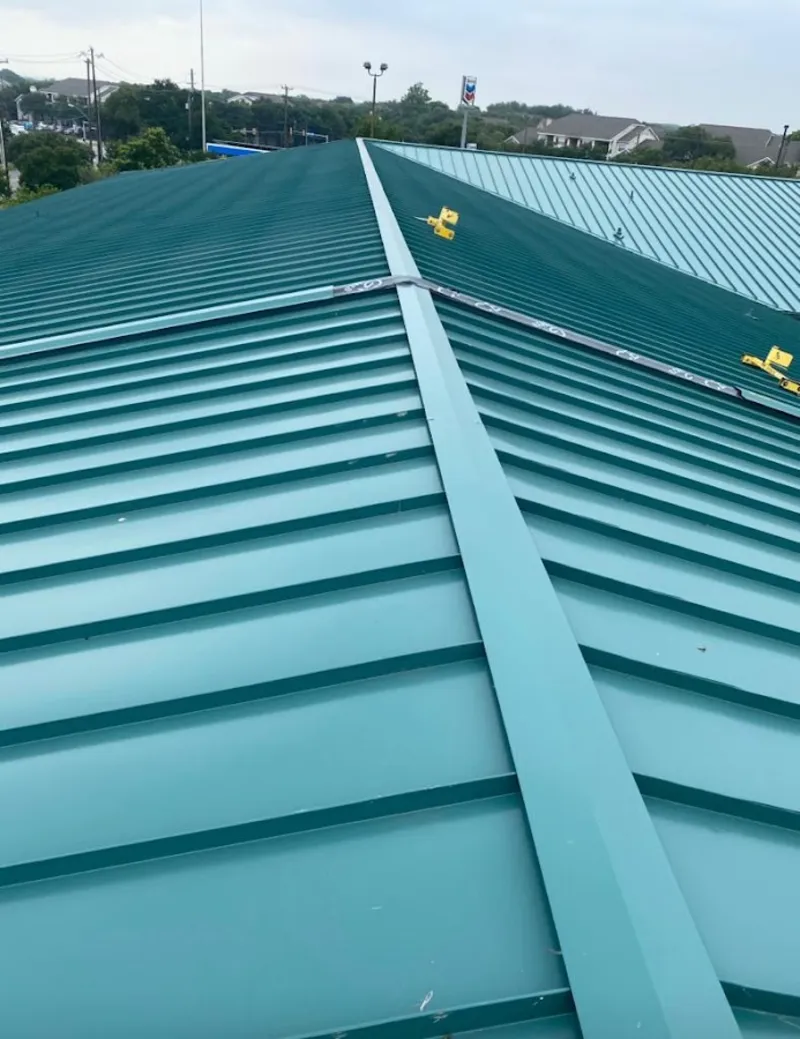 Green commercial metal roof ridge and valley for Metal Roof Repair in Sienna